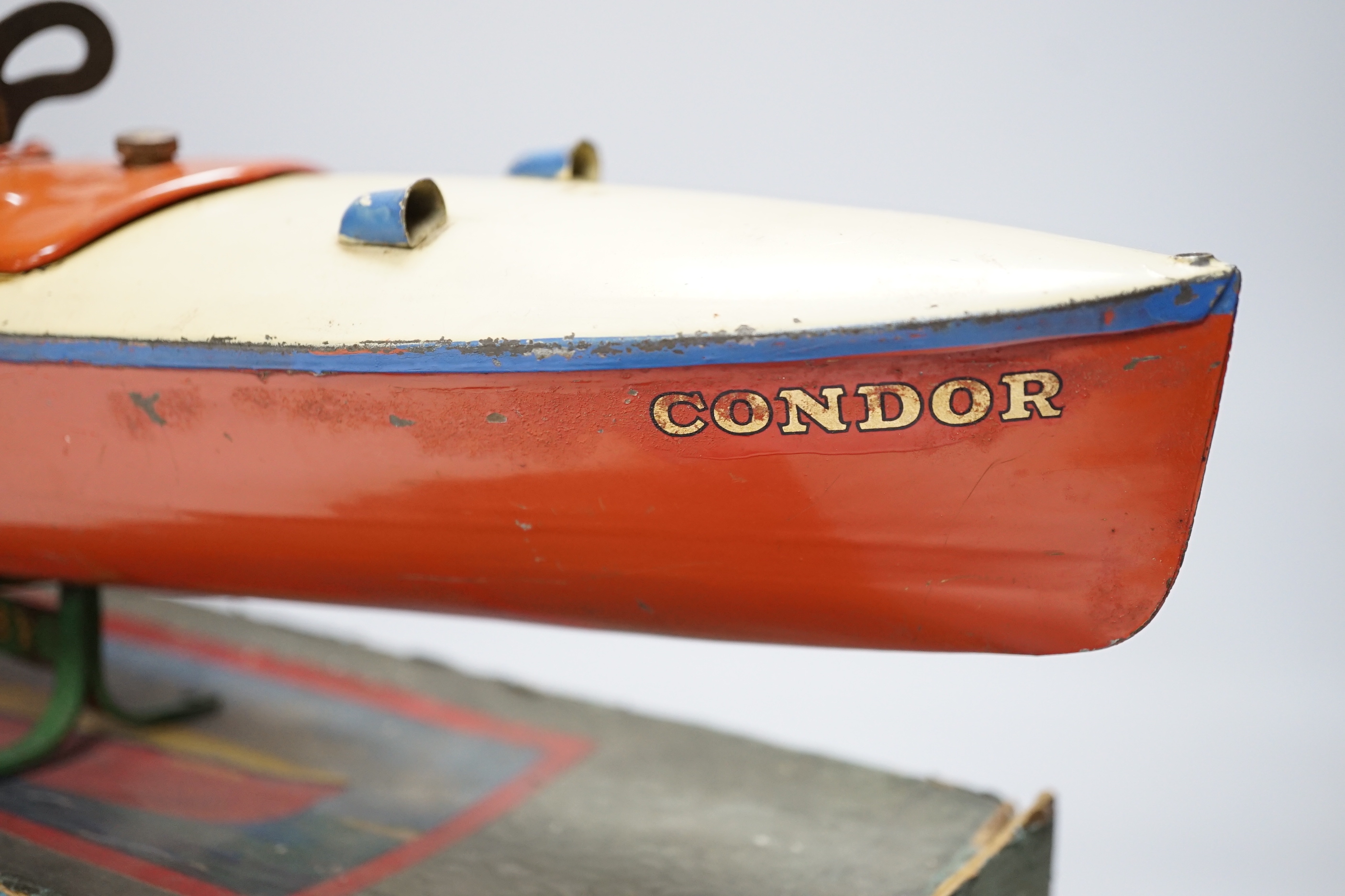 A boxed, Hornby No.3 Condor clockwork speed boat, with original stand, length of hull 41.5cm